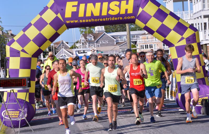 Runners start the half-marathon or 5K on a sunny morning at Lewes Beach. DAVE FREDERICK PHOTOS